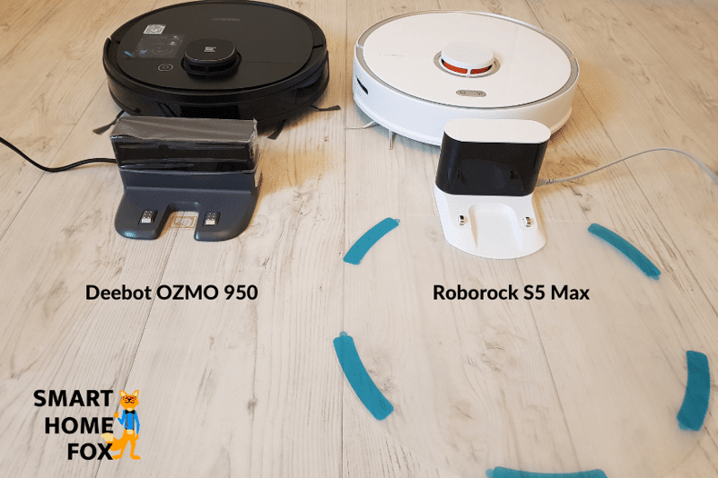 The Ecovacs Deebot OZMO 950 and Roborock S5 Max’s charging docks next to each other on the floor.